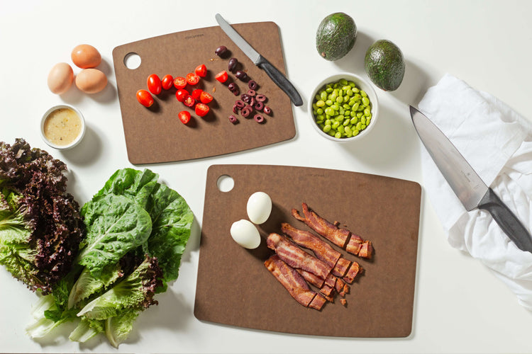 Epicuren Kitchen Series Cutting Board Set in Nutmeg sizes 14.5 inches by 11.25 inches and 11.5 inches by 9 inches ready to support your culinary adventures by slicing assorted vegetables and proteins.