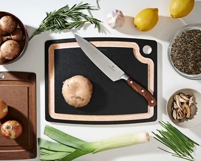 Gourmet Series Cutting Board in Slate with a Victorinox Chef's Knife Preparing To Cut Assorted Vegetables