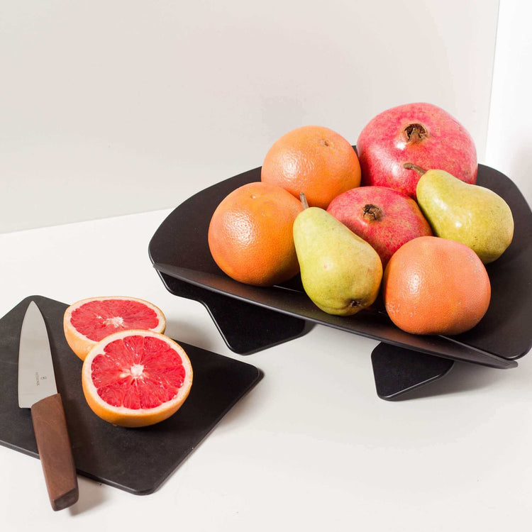 Epicurean Collapsible Large Bowl in Slate with Pears, Pomegranates, Apples and Mangos with a sliced Pomegranate courtesy of Victorinox Swiss Modern Carving Knife with Wood Handle