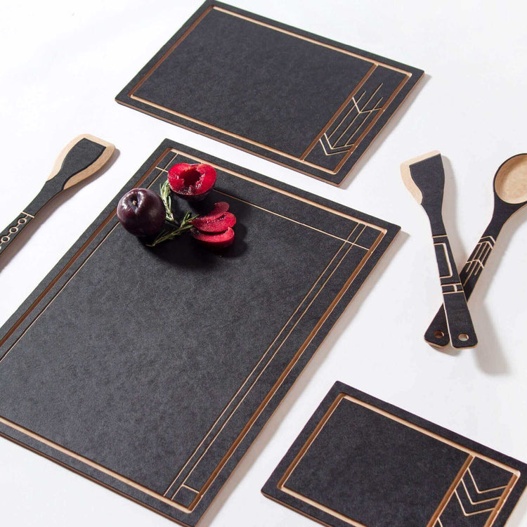 The Frank Lloyd Wright Collection featuring Cut and Serve Small, Medium and Large Boards, Saute Tool, Large Spoon & Paddle in Slate/Natural 