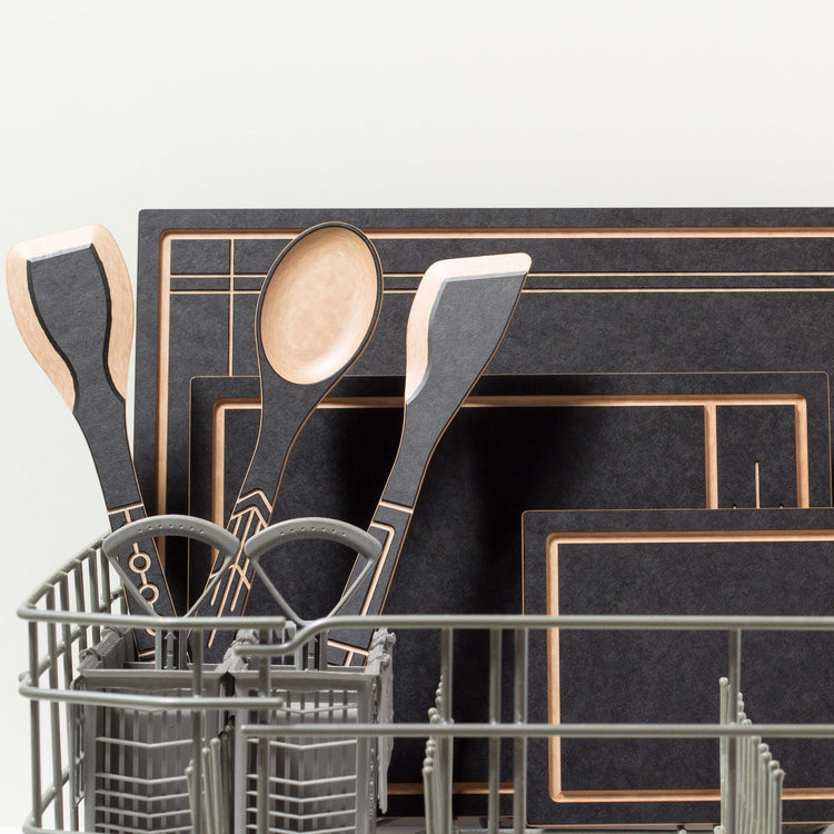 The Frank Lloyd Wright Cut & Serve Collection Boards in Small, Medium & Large Slate/Natural placed in the dishwasher