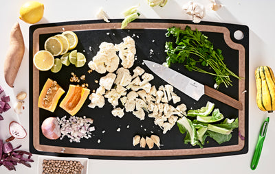  Gourmet Series Cutting Board Slate 27x17 with assorted sliced vegetables and a Victorinox Swiss Modern Chef's Knife