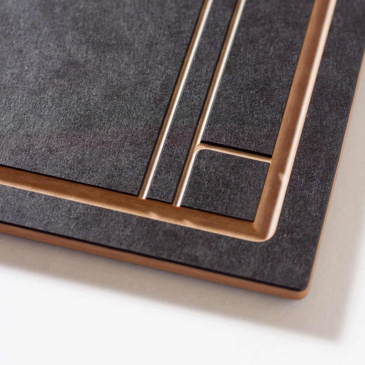 The Frank Lloyd Wright Large Cut and Serve Board close up detail in Slate/Natural