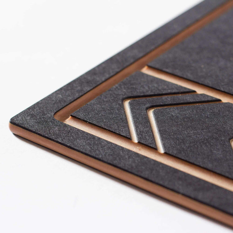 The Frank Lloyd Wright Small Cut and Serve Board close up detail in Slate/Natural