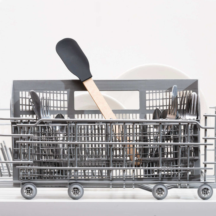 Epicurean Silicone Series Natural/Black Small Spoonula sitting in a dishwasher silverware basket