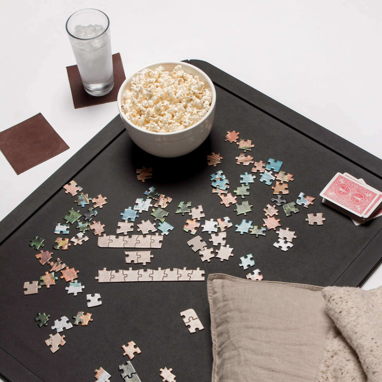 Epicurean Board Game Board in Medium Slate Ready For Game Night with colorful assorted puzzle pieces, popcorn and a deck of cards