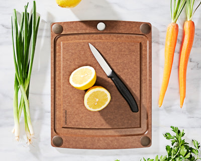 All-in-One Nutmeg Cutting Board Size 12x9 With Sliced Lemons and Vegetables and Victorinox Knife