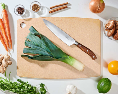 Epicurean Kitchen Series Cutting Board in Natural with fruits and vegetables ready to be sliced with a Victorinox Chef's Knife