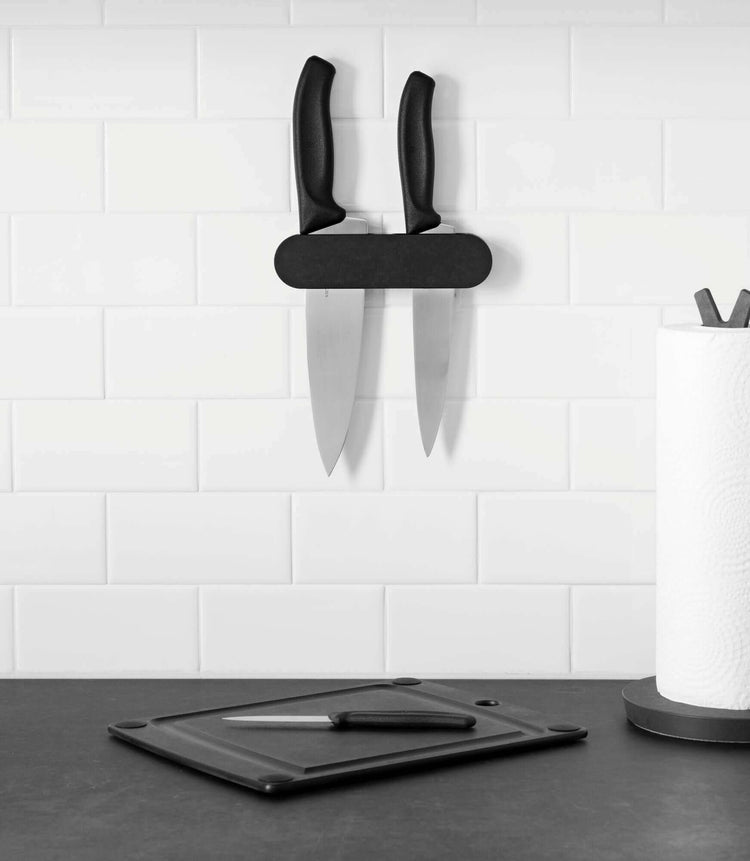 Epicurean Three Slot Mounted Knife Holder in Slate attached to the wall with assorted Victorinox Knives, completing the countertop collection with an Epicurean paper towel holder and All In One Cutting Board in Slate