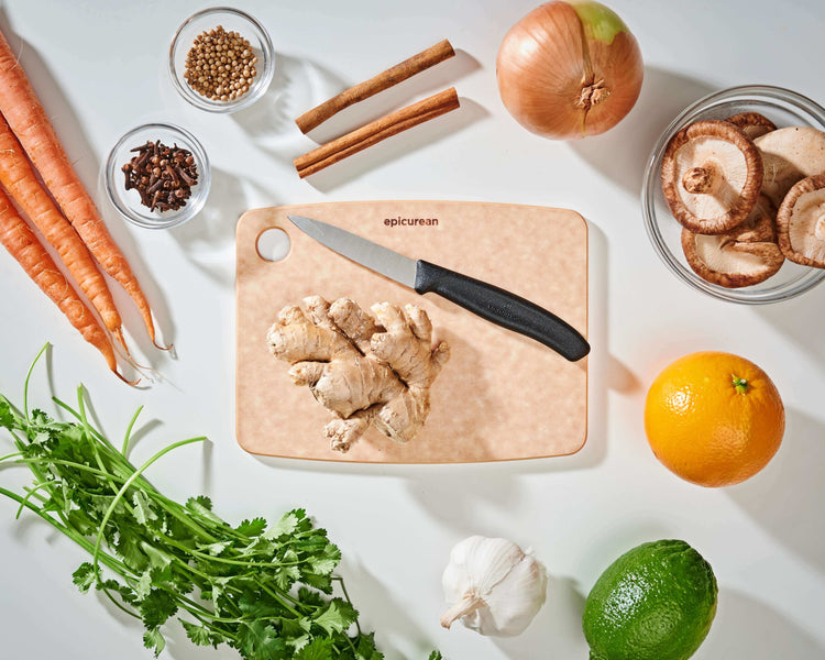Epicurean Kitchen Series Cutting Board in Natural with fruits and vegetables ready to be sliced with a Victorinox Swiss Classic Paring Knife