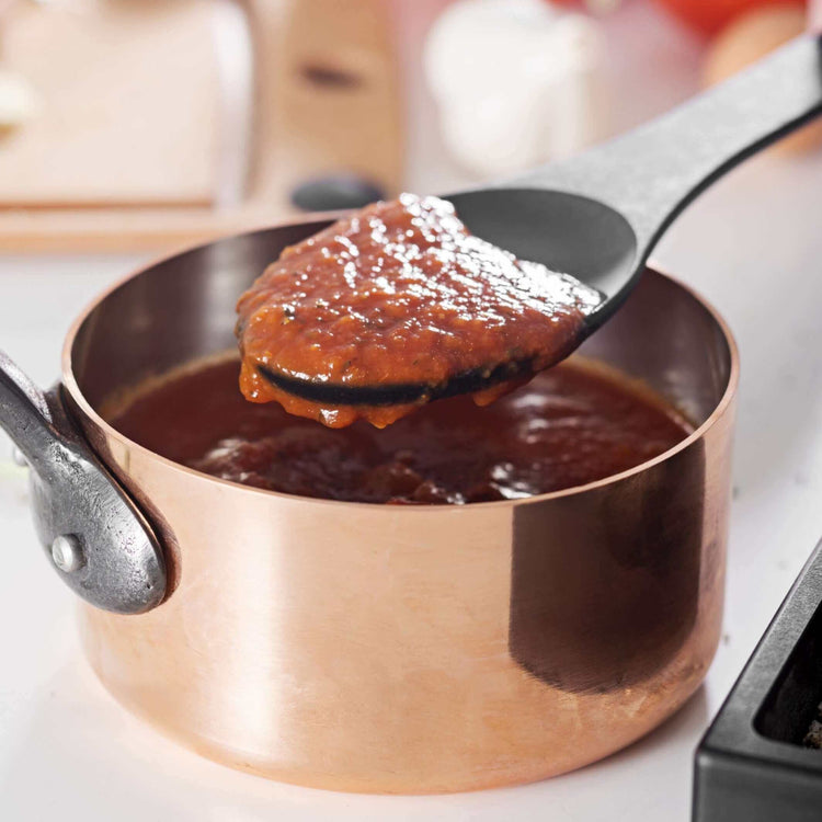 Epicurean Kitchen Series Slate Spoon scooping up red sauce