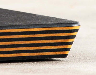 A close up shot of the Big Block Board corner, further showcasing the striking Slate/Natural cascade lamination pattern.
