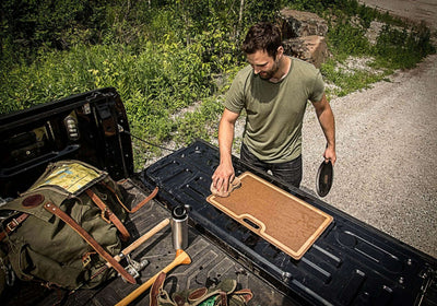 Big Game Cutting Board 23x15 Nutmeg Being Cleaned On A Tailgate