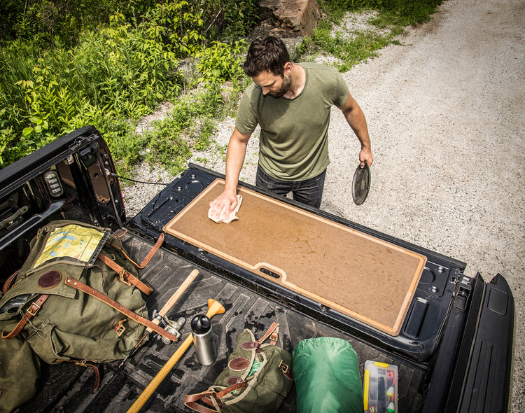 Big Game Cutting Board Nutmeg Being Cleaned on a Tailgate